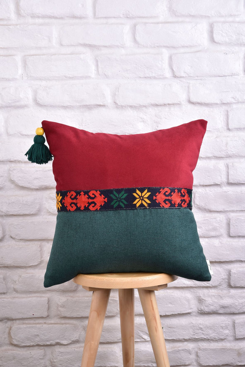 Cushion with embroidered strip